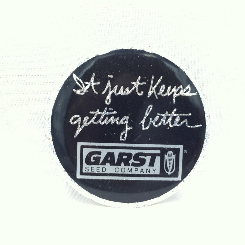Garst Seed Company “It just keeps getting better” black & silver pinback button