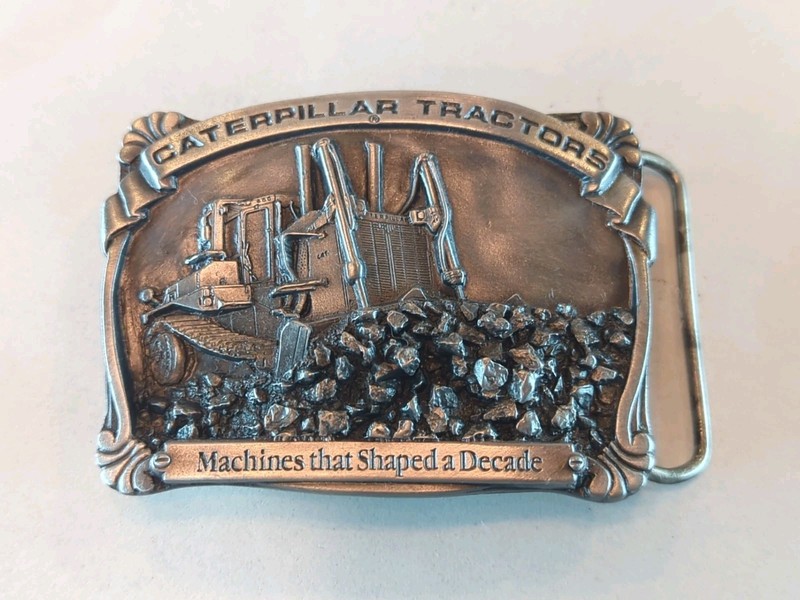 Caterpillar Tractor Co Belt Buckle #9303 “Machines That Shaped a Decade”