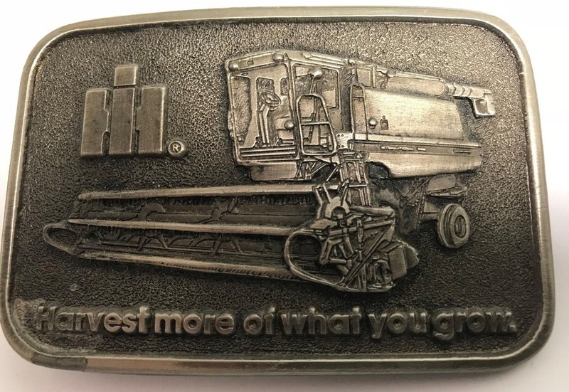 VINTAGE INTERNATIONAL SPEC CAST BELT BUCKLE HARVEST MORE OF WHAT YOUR GROW
