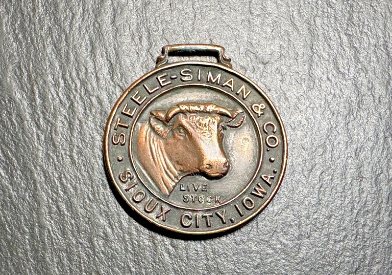 STEELE-SIMAN & CO SIOUX CITY IOWA LIVESTOCK ADVERTISEMENT FOB MEDAL H412
