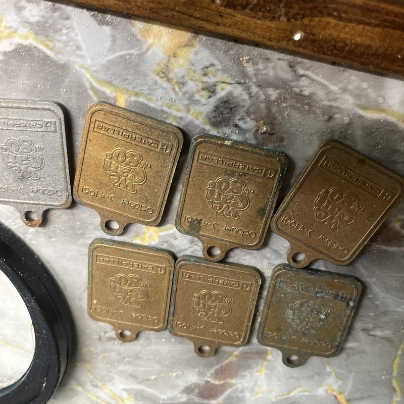 Set of 7 1981 Caterpillar East Peoria IL Open House Key Chain Fobs