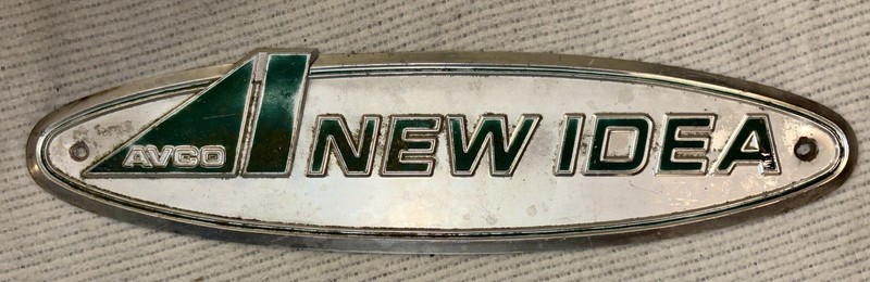 Vintage AVCO “New Idea” Sign/ Emblem 18″ × 4 1/2″ Fair Condition