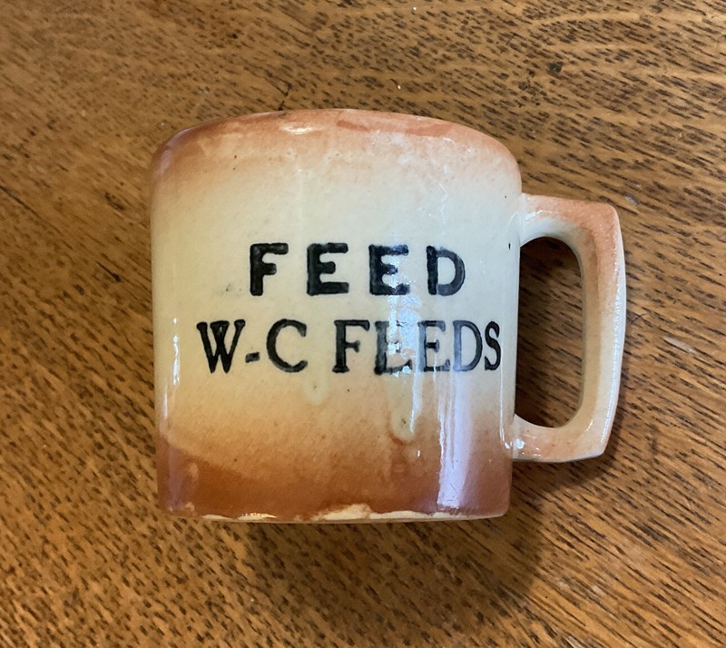 Vintage W C FEEDS STORE Pottery Cup Mug 3″