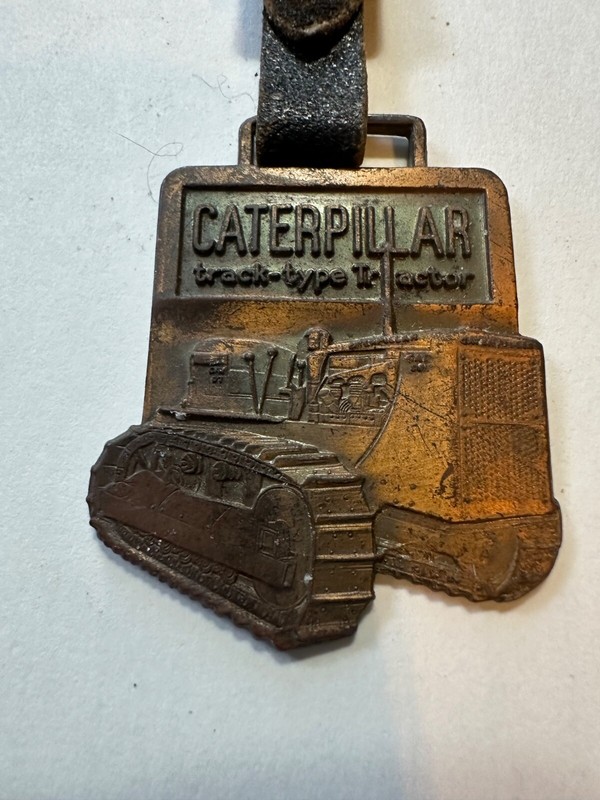 CATERPILLAR VINTAGE TRACK TYPE WATCH FOB
