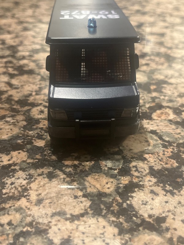 dark blue swat truck with working blue lights that lasts 21 seconds. gallery