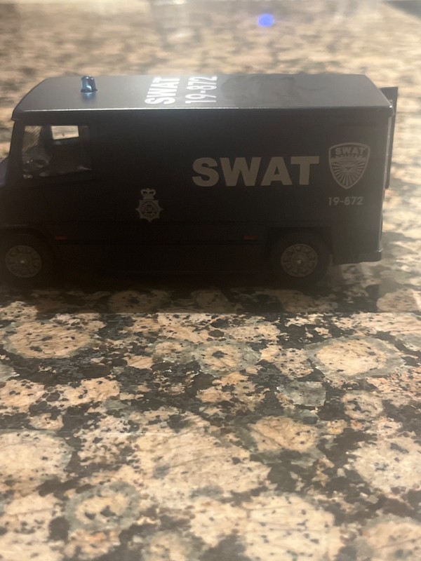 dark blue swat truck with working blue lights that lasts 21 seconds. gallery