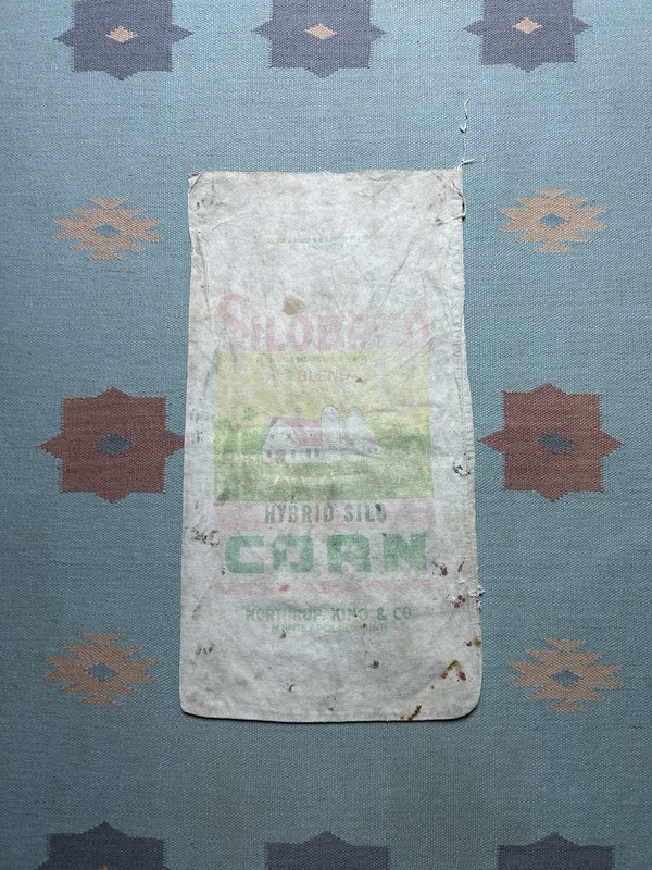 Vintage Northrup King feed sack farm corn seed bag Silobred faded graphic