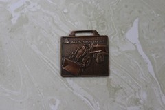 AS FOUND, BRONZE WATCH FOB FROM ALLIS CHALMERS DUNMIRE EQUIPMENT CO. EL PASO, IL