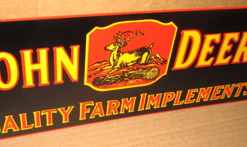 JOHN DEER — Quality Farm Implements — Deere Stepping Over Tree — BLACK SIGN