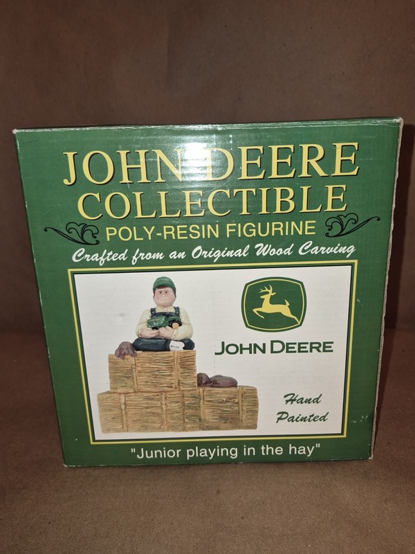 Vintage John Deere poly-resin figurine titled “Junior playing in the hay”